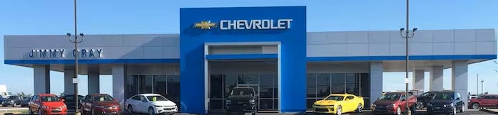 Front view of the Jimmy Gray Chevrolet dealership with several cars parked